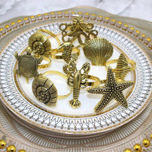 Load image into Gallery viewer, Gold Ocean Themed Napkin Rings 8pc Set
